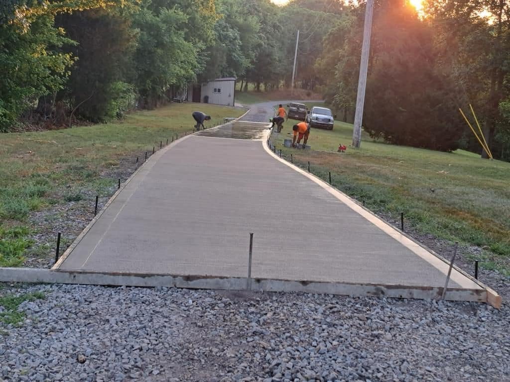 Curved concrete driveway being poured