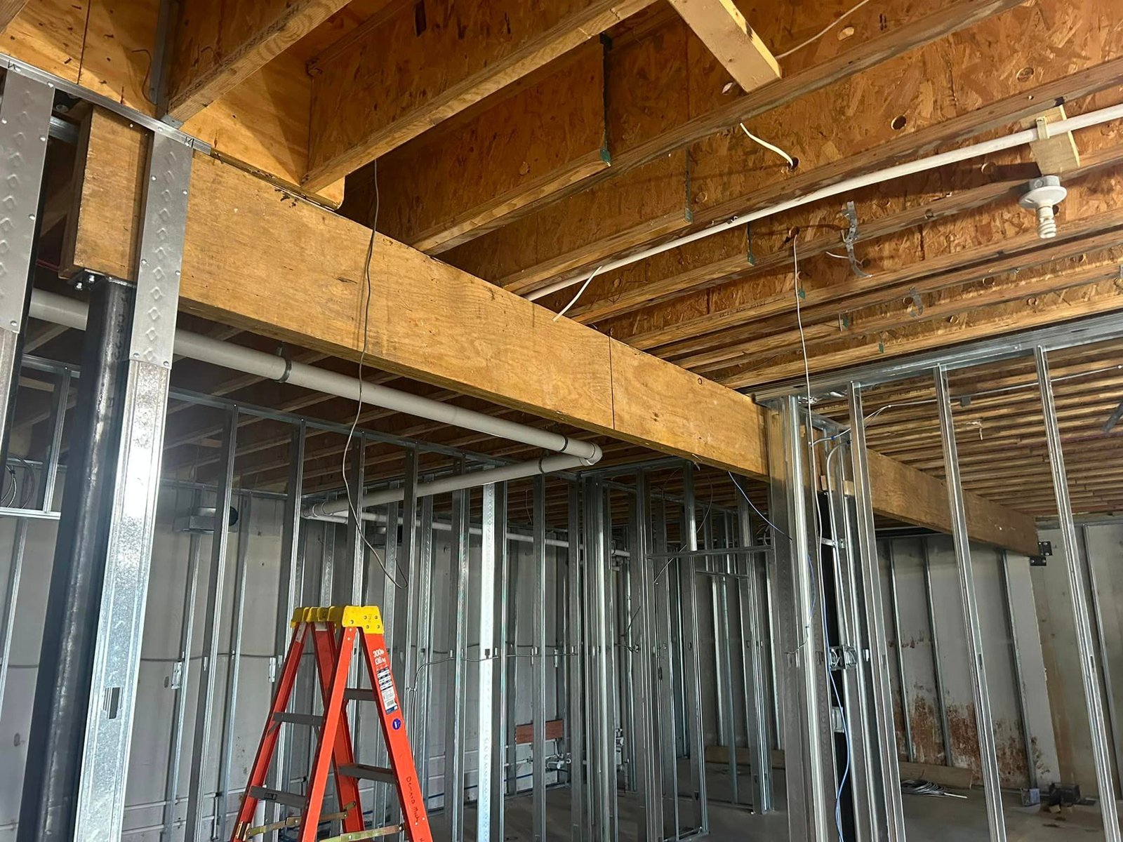 Structural renovation with steel beam support