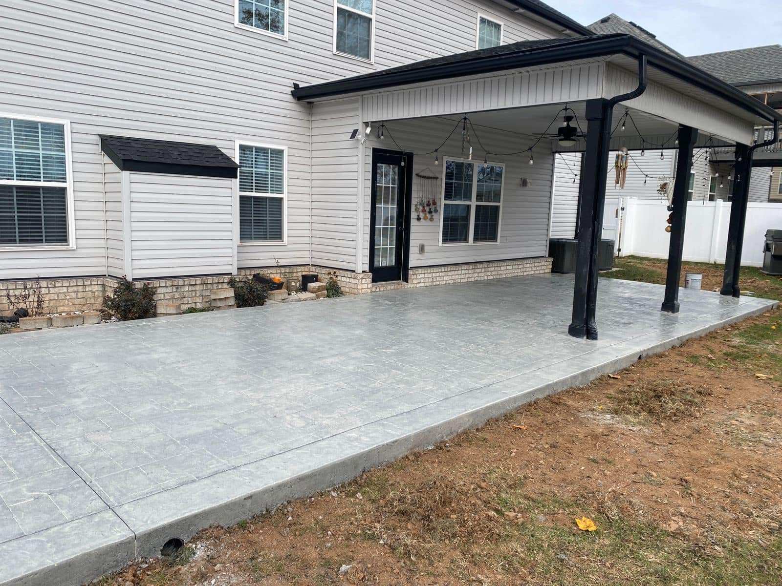 Covered patio remodel with concrete slab built by Forge Build Group