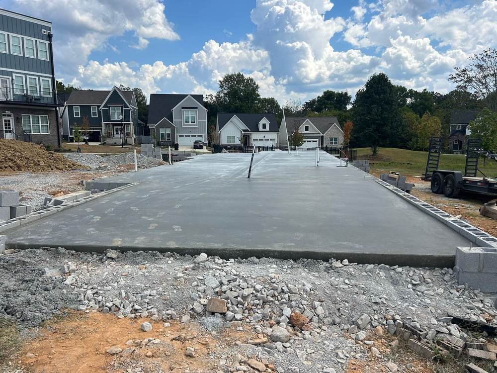 Large poured concrete pad for new construction